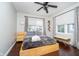 Bright bedroom with hardwood floors, soft bedding, and plenty of natural light at 6167 Carrollton Ave, Indianapolis, IN 46220