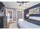 Well-lit bedroom featuring a plush bed, stylish decor, and carpet flooring at 6167 Carrollton Ave, Indianapolis, IN 46220