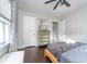 This bedroom has a ceiling fan, a window letting in light and a small dresser for storing items at 6167 Carrollton Ave, Indianapolis, IN 46220