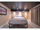 Cozy bedroom with recessed lighting, features a comfortable queen-sized bed and stylish decor at 6167 Carrollton Ave, Indianapolis, IN 46220