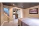 Cozy bedroom with recessed lighting, features a comfortable queen-sized bed and stylish decor at 6167 Carrollton Ave, Indianapolis, IN 46220