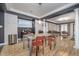 Bright dining area with seating for four, modern table, and seamless living room access at 6167 Carrollton Ave, Indianapolis, IN 46220