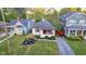 Charming single-story home featuring a red front door and beautifully landscaped front yard at 6167 Carrollton Ave, Indianapolis, IN 46220