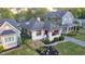 Lovely white brick home featuring covered porch with swing and beautiful landscaping at 6167 Carrollton Ave, Indianapolis, IN 46220