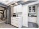 Contemporary kitchen featuring stainless steel appliances, marble countertops, and streamlined cabinetry for ample storage at 6167 Carrollton Ave, Indianapolis, IN 46220