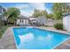 Backyard features a refreshing in-ground pool, providing a perfect oasis for relaxation and recreation at 6167 Carrollton Ave, Indianapolis, IN 46220