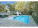 Backyard features a refreshing in-ground pool, providing a perfect oasis for relaxation and recreation at 6167 Carrollton Ave, Indianapolis, IN 46220