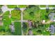 Aerial view of the property showcases lush greenery, neighboring homes, and the surrounding landscape at 6191 Geneva St, Stilesville, IN 46180