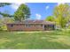 Well-maintained brick home with a screened-in porch and a spacious, green backyard at 6191 Geneva St, Stilesville, IN 46180