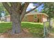View of the backyard with a large tree at 6191 Geneva St, Stilesville, IN 46180