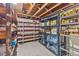 Basement with plenty of storage space, featuring rows of shelving stocked with goods at 6191 Geneva St, Stilesville, IN 46180
