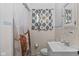 Cozy bathroom with a decorative shower curtain, tiled walls, and modern fixtures at 6191 Geneva St, Stilesville, IN 46180