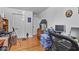 Bedroom featuring hardwood floors, ample work space, and storage solutions at 6191 Geneva St, Stilesville, IN 46180