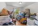 Bedroom space showcasing hardwood floors, window view, and ample storage solutions at 6191 Geneva St, Stilesville, IN 46180