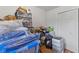 Bedroom showing hardwood floors, closet and storage solutions at 6191 Geneva St, Stilesville, IN 46180