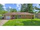 Charming brick ranch home featuring a well-manicured lawn and an attached single-car garage at 6191 Geneva St, Stilesville, IN 46180