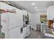 Functional kitchen with white cabinets and essential appliances for meal preparation at 6191 Geneva St, Stilesville, IN 46180