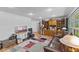 Spacious living room featuring hardwood floors, a built-in bookcase, and a comfortable leather couch at 6191 Geneva St, Stilesville, IN 46180