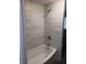 Modern bathroom featuring a tiled shower-over-tub and stylish fixtures at 623 Orange St, Indianapolis, IN 46203