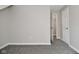 Bedroom with neutral paint, carpeted floors, and doors leading to other areas of the house at 623 Orange St, Indianapolis, IN 46203
