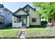 Charming two-story home with a fenced yard and welcoming front porch at 623 Orange St, Indianapolis, IN 46203