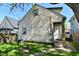 Exterior home view showing backyard, siding, door, windows and grass at 623 Orange St, Indianapolis, IN 46203