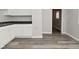 Neutral kitchen area featuring updated cabinets and wood look floor at 623 Orange St, Indianapolis, IN 46203