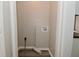The laundry room has tile flooring with water hookups ready for a washer and dryer at 623 Orange St, Indianapolis, IN 46203