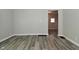 Living room with neutral paint, large base trim and wood look luxury vinyl plank flooring at 623 Orange St, Indianapolis, IN 46203
