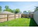 Lovely backyard featuring a grassy lawn, wooden fence, and outdoor seating at 625 Dequincy St, Indianapolis, IN 46201