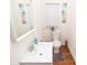 Bright bathroom featuring a white vanity, modern fixtures, and decorative wall art at 625 Dequincy St, Indianapolis, IN 46201