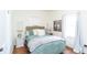Bedroom with modern bed, decorative bedside table, and natural light from the windows at 625 Dequincy St, Indianapolis, IN 46201