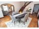 Dining area with hardwood floors, a modern light fixture, and easy access to the living room at 625 Dequincy St, Indianapolis, IN 46201