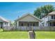 Charming home with a well-maintained lawn and classic architectural details, a welcoming facade at 625 Dequincy St, Indianapolis, IN 46201