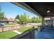 Relaxing covered front porch featuring a swing and view of the charming neighborhood at 625 Dequincy St, Indianapolis, IN 46201
