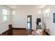 Cozy hallway nook with chair, side table, and hardwood floors at 625 Dequincy St, Indianapolis, IN 46201