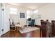 Inviting home office space featuring a comfortable chair, a desk, and natural light from two windows at 625 Dequincy St, Indianapolis, IN 46201
