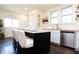 Kitchen with stainless steel appliances, light countertops, and view to the backyard at 625 Dequincy St, Indianapolis, IN 46201
