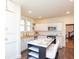 Well-lit kitchen with stainless steel appliances and an island with barstool seating at 625 Dequincy St, Indianapolis, IN 46201