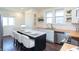Kitchen island with bar seating, wood countertops, and stainless steel appliances at 625 Dequincy St, Indianapolis, IN 46201