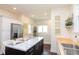 Spacious kitchen with an island and room for seating with stainless steel refrigerator at 625 Dequincy St, Indianapolis, IN 46201