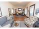 Cozy living room featuring hardwood floors, neutral paint, stylish decor, and abundant natural light at 625 Dequincy St, Indianapolis, IN 46201