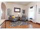 Bright living area with hardwood floors, neutral walls, stylish decor, and great natural lighting at 625 Dequincy St, Indianapolis, IN 46201