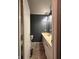 View of the bathroom featuring a sink vanity and modern lighting fixtures at 6432 Commons Dr, Indianapolis, IN 46254