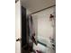 Bright bathroom showcasing the shower and bathtub with tile walls at 6432 Commons Dr, Indianapolis, IN 46254