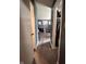 Bedroom view through an open doorway with hardwood floors and ample closet space at 6432 Commons Dr, Indianapolis, IN 46254