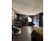 Well lit bedroom area with hardwood flooring, and wall decor at 6432 Commons Dr, Indianapolis, IN 46254