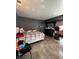Bedroom with tile flooring, dresser, and bed; a functional space for relaxation and rest at 6432 Commons Dr, Indianapolis, IN 46254