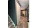 Hallway leading to the living room, showcasing tile flooring and a neutral color scheme at 6432 Commons Dr, Indianapolis, IN 46254