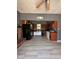 Open kitchen with wood cabinets, gray walls, and tile floors, perfect for modern living at 6432 Commons Dr, Indianapolis, IN 46254